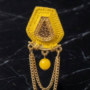 Elegant Yellow Shield Brooch with Gold-Toned Chains